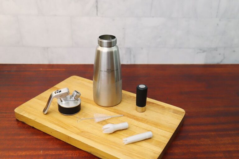 Cream whipper on table